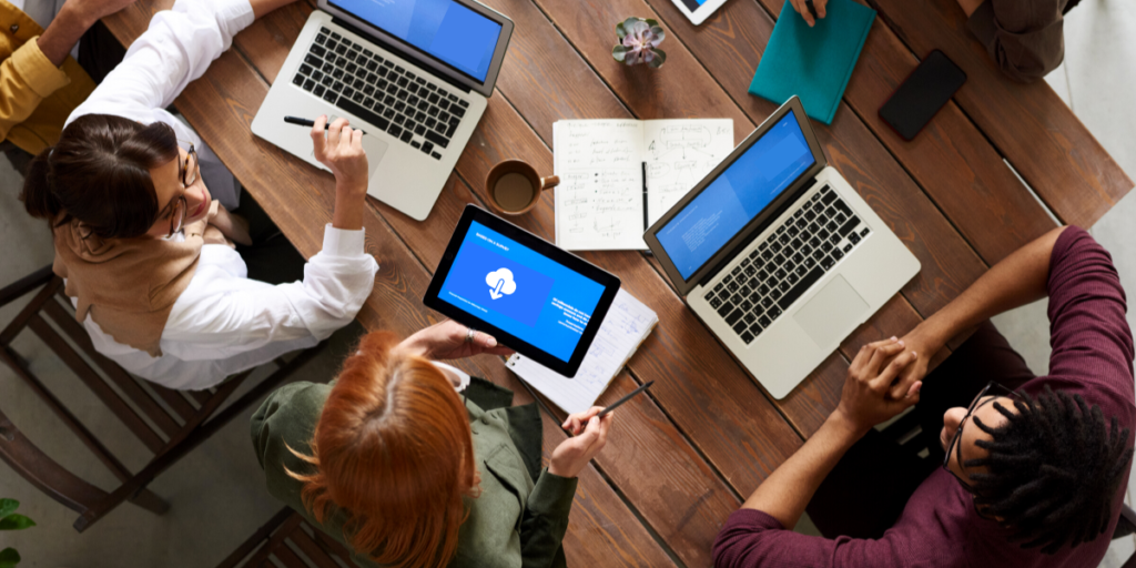 CSI-Disaster-Recovery-Process-with-IT-team-1 | Copy Systems Inc. group of people sitting around table with their devices