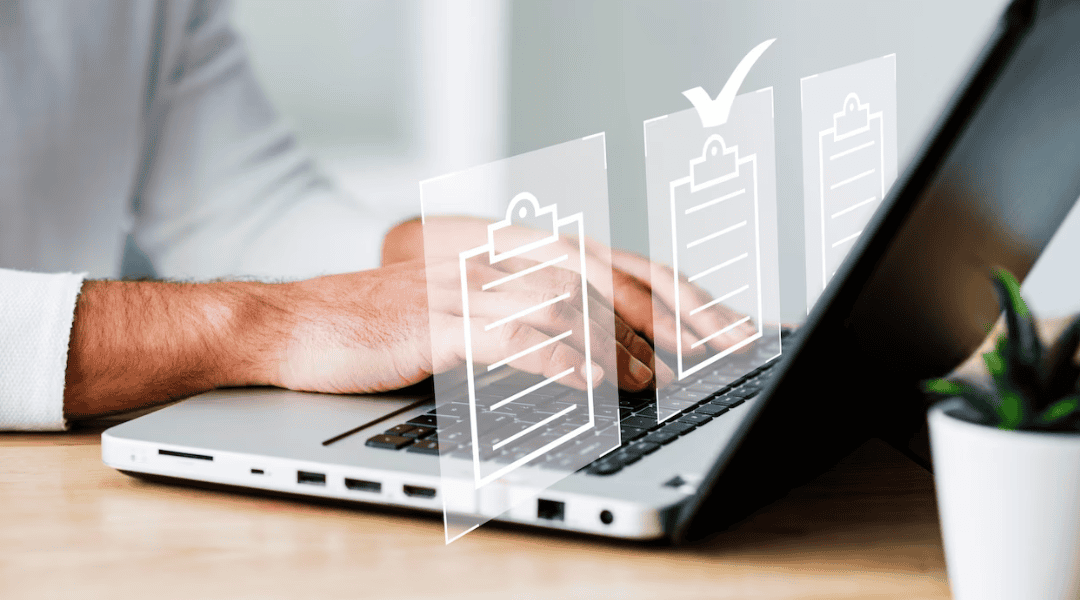 person typing on computer with overlay of three document icons