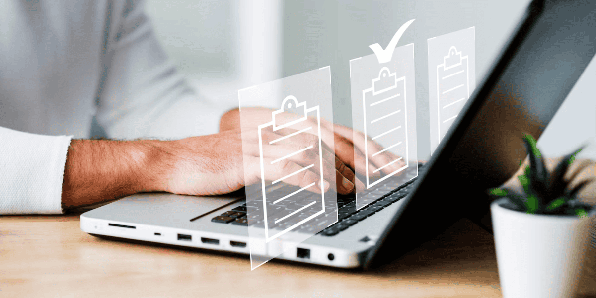 person typing on computer with overlay of three document icons