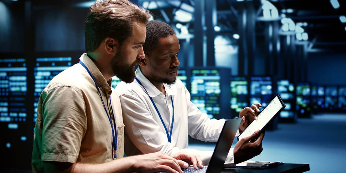 Coworkers running data center tests