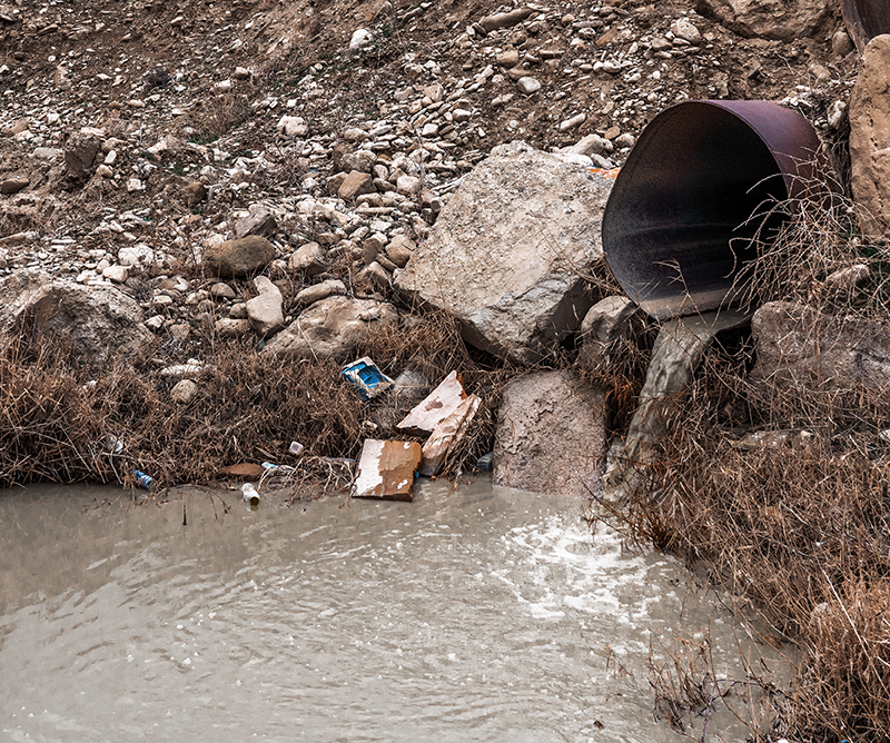 dirty-waste-water-from-the-pipe-environmental-pol-2026-01-09-10-05-12-utc | Copy Systems Inc. dirty water draining out of pipe into pond
